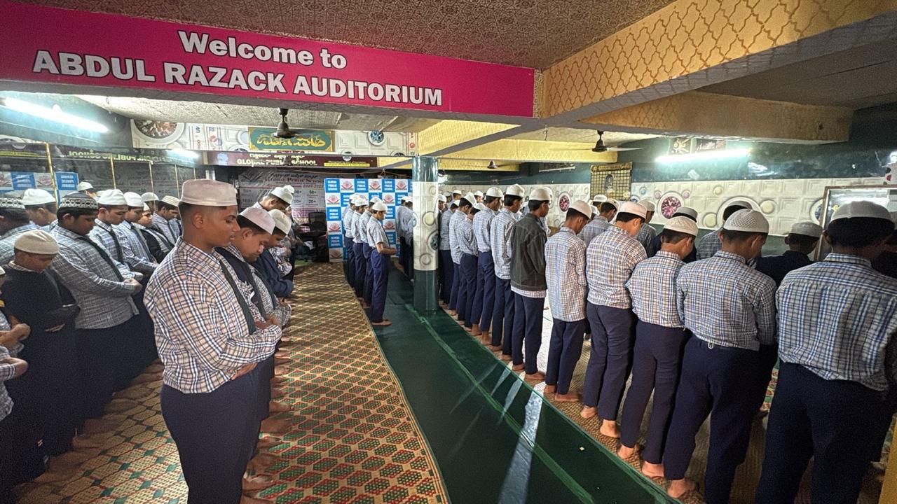 Students offering prayers in the auditorium