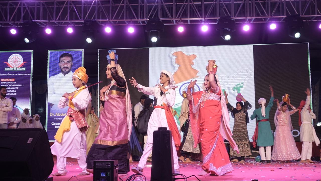 Students performing a folk dance with pots