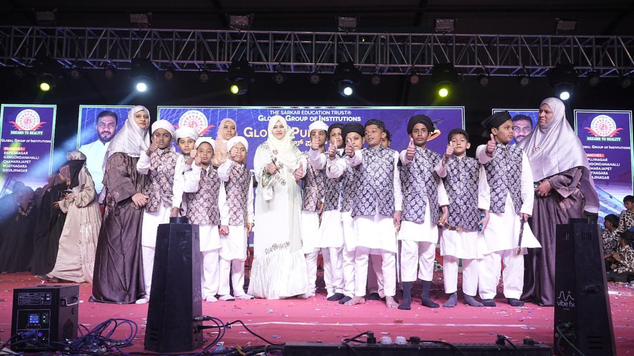 Students and staff group photo on stage