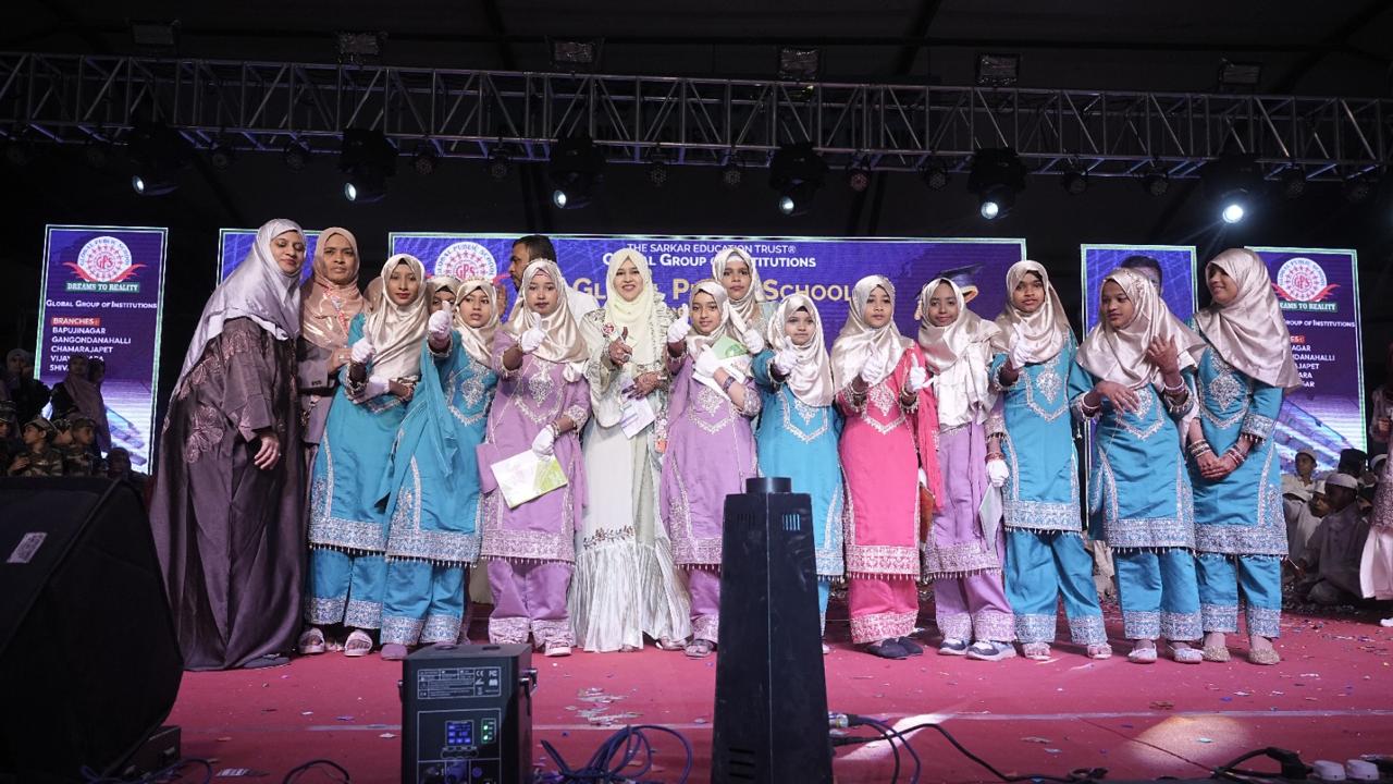 Girls in colourful attire on stage