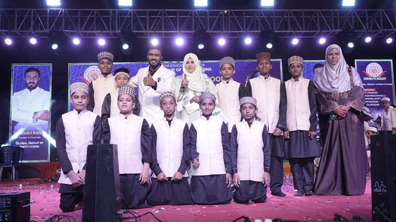 Boys group photo with teachers on stage