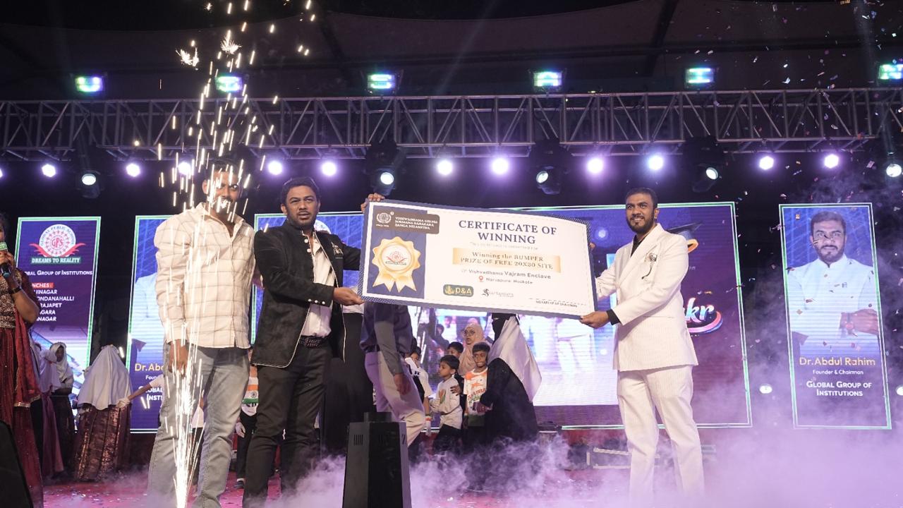 Management displays a winners' certificate on stage