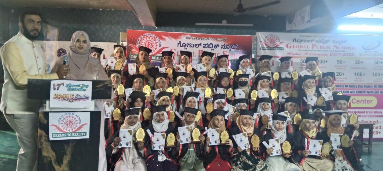Graduating students hold trophies and certificates