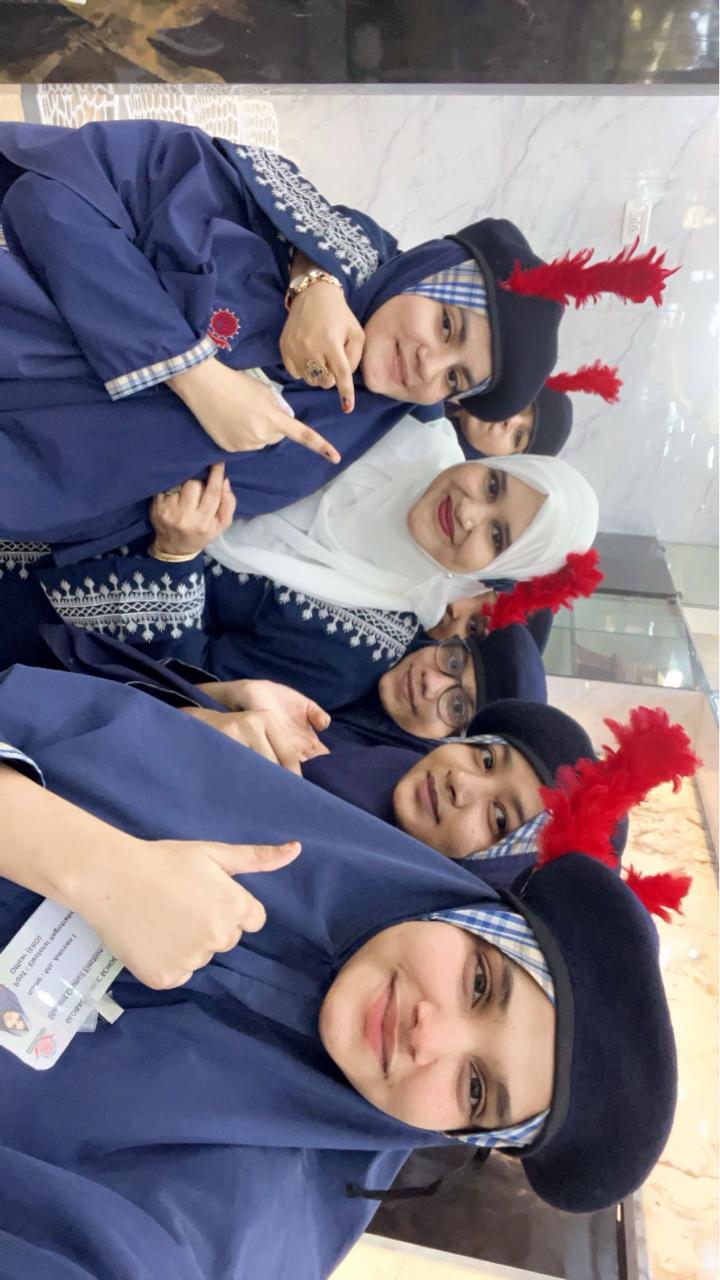 Cheerful teachers pose for a group selfie