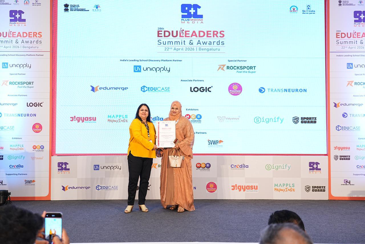 Award presented on stage at an education summit