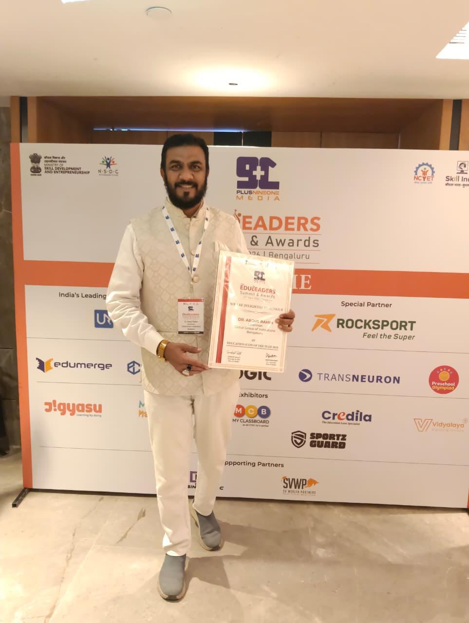 Chairman holds the Education Icon certificate