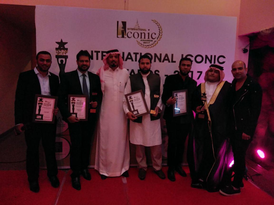 Award winners group at an iconic awards ceremony