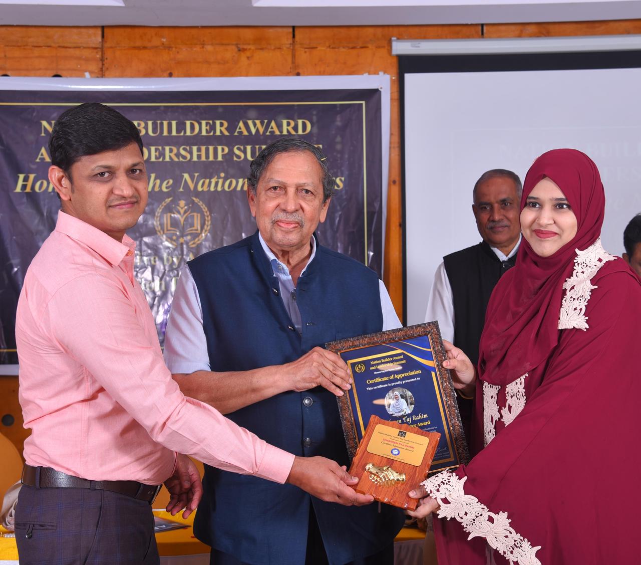 Leadership receives a Nation Builder award certificate