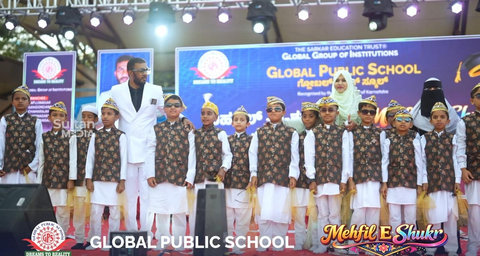 Children in traditional costumes on stage